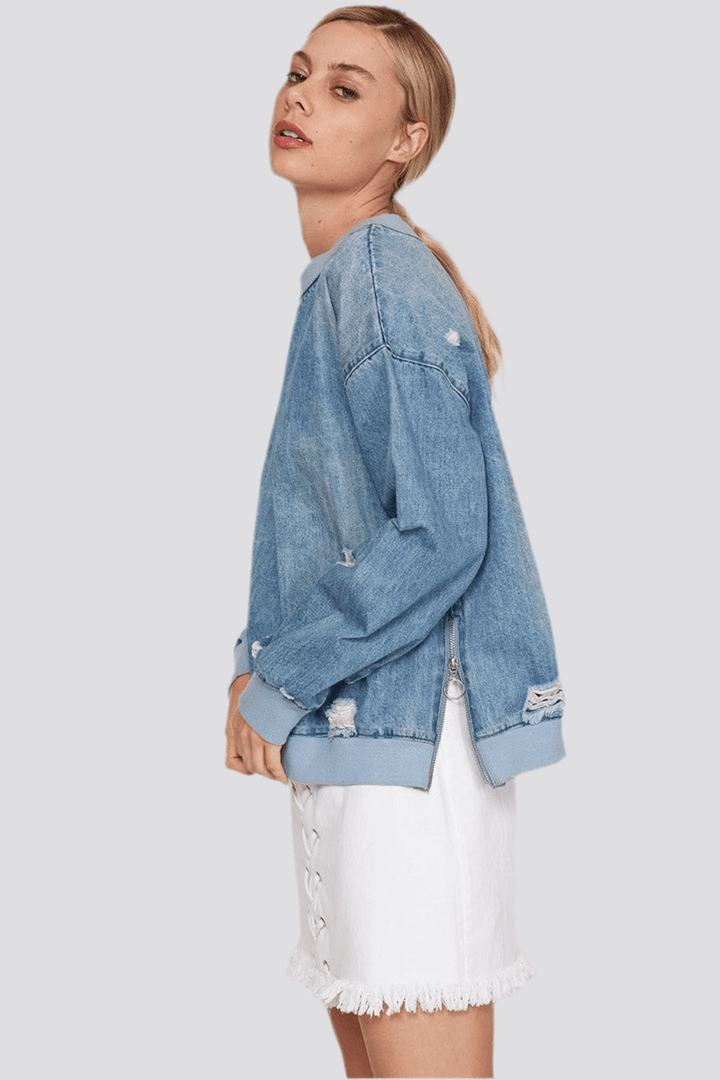 Denim Lover Sweatshirt with side zipper detail and banded hem, made of 100% cotton distressed denim.