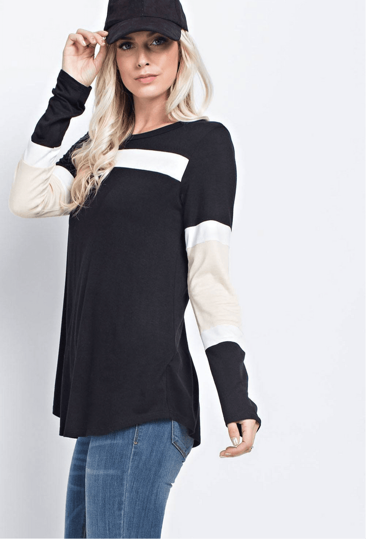 Color block long sleeve top in black and white with relaxed fit.