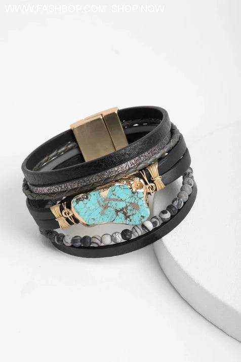 Turquoise leather cuff with marbled semi-precious beads and magnetic closure.