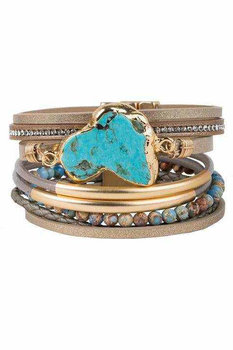 Turquoise leather cuff with marbled beads and magnetic closure, featuring genuine turquoise stone.