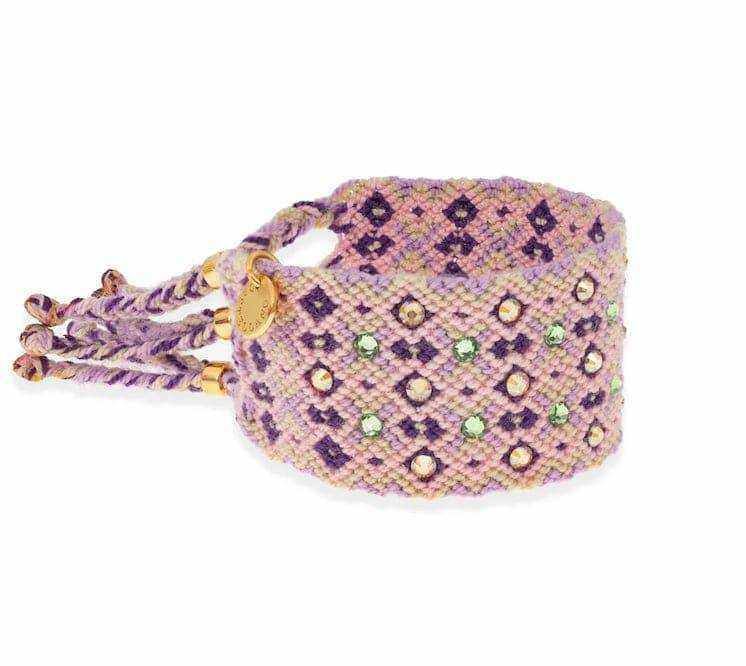 Swarovski Crystal Woven Give Back Cuff Bracelet with purple and gold accents, handwoven by Wayuu artisans, adjustable and embellished with Swarovski crystals.